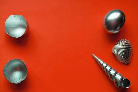 Silver eggs and shells on colored background Foto stock