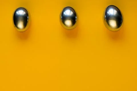 Silver eggs and shells on colored background Stockfoto's