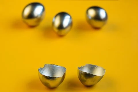 Silver eggs and shells on colored background Foto stock