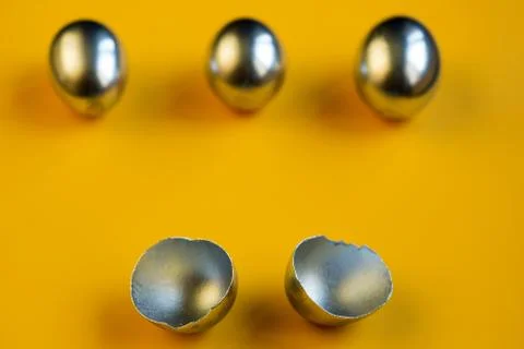 Silver eggs and shells on colored background 写真素材