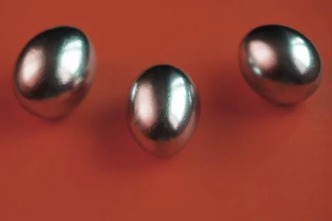 Silver eggs and shells on colored background Foto stock