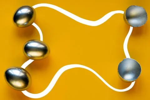 Silver eggs and shells on colored background Stockfoto's