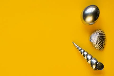 Silver eggs and shells on colored background 写真素材