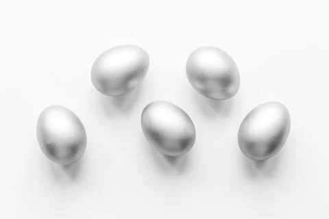 Silver eggs isolated on white background. Easter decoration background. Top view Stock Photos