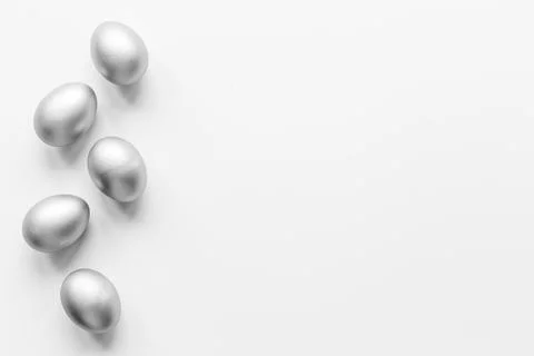Silver eggs isolated on white background. Easter decoration background. Top view Stock Photos