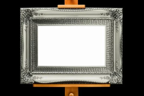 Silver Elegant Rococo Frame on a stand. Blank copy space. Black Background. Stock-Fotos