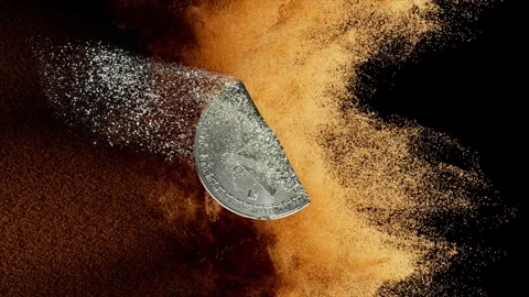 Silver ethereum coin gets covered with sand, gradually disappearing beneath a Stock Footage 291530380