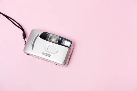 Silver film camera on pink background top view, Stock Photos