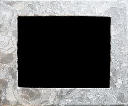 Silver flower embossing. Foil frame with pattern of flowers Stock Photos