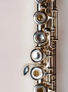 Silver flute  isolated on brown background with clipping path Stock Photos