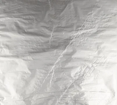 Silver foil. The background is made of gray crumpled foil, Photos