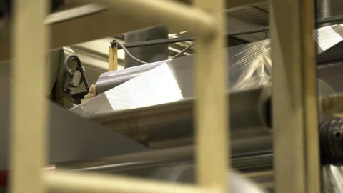 Silver foil carried by automatic production line in workshop Stock-Footage 283384574