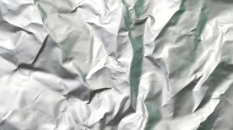 Silver foil with rough texture for background,crumpled paper, uneven surface. Stockfoto's
