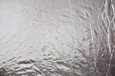 Silver foil shiny metallic texture background wrapping paper for Christmas an Stock Photos