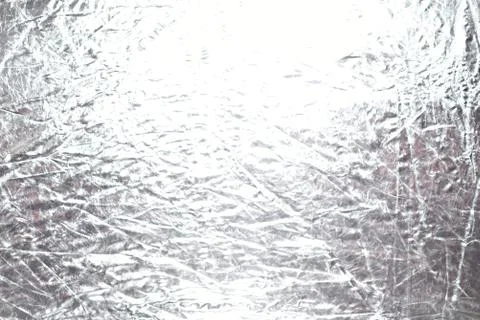Silver foil shiny metallic texture background wrapping paper for Christmas an Stock Photos