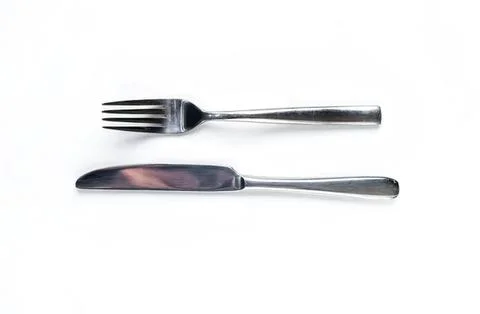 Silver fork and knife on white background Stock Photos