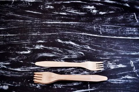 Silver fork lying on a wooden table. Cutlery for eating. Device Stock Photos