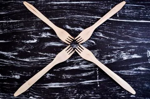 Silver fork lying on a wooden table. Cutlery for eating. Device Stock Photos