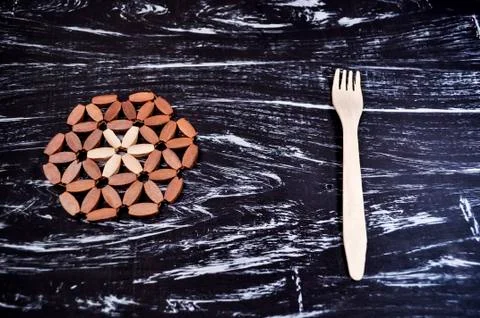 Silver fork lying on a wooden table. Cutlery for eating. Device Stock Photos