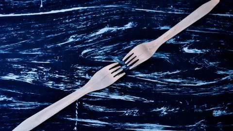 Silver fork lying on a wooden table. Cutlery for eating. Device Stock Photos