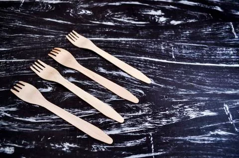 Silver fork lying on a wooden table. Cutlery for eating. Device Stock Photos