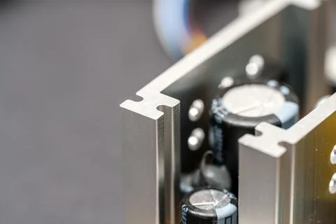 Silver frame of electronics holding capacitors in a mechanical structure Stock Photos