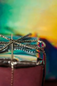 Silver gift box on multicolored bright gradient background. Festive backdrop Stock Photos