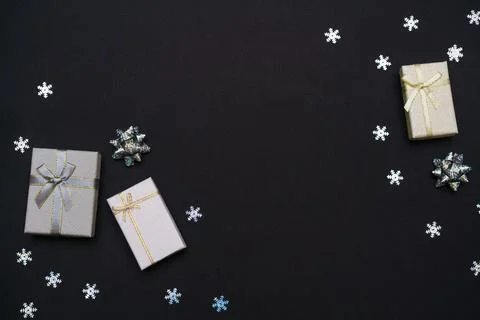 Silver gift boxes. Gift box with gold ribbon, new year's decor and snowflakes Stock Photos