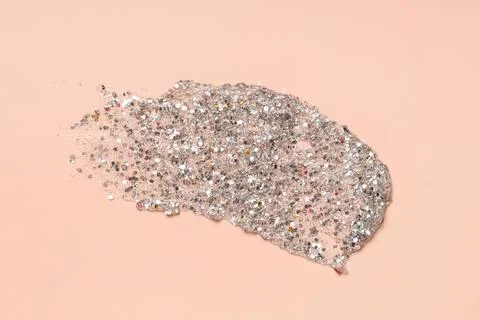 Silver glitter stroke on beige background Stock Photos