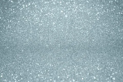 Silver glitter texture background with blur light effect and shiny sparkling  Stock Illustration