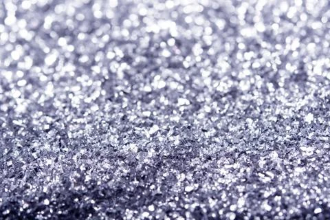 Silver glitter texture. Festive sparkling sequins background closeup. Stock Photos