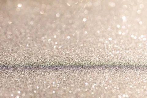 Silver glittering background for design and free space. Stock Photos