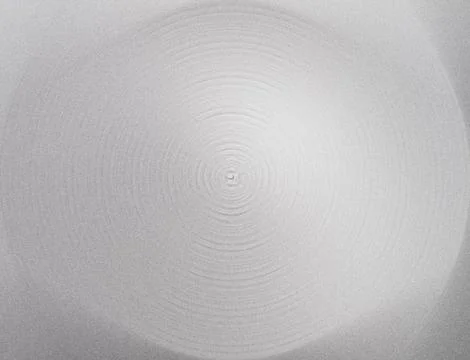 Silver-gray abstract background featuring concentric circular rings and a s.. Stock Illustration