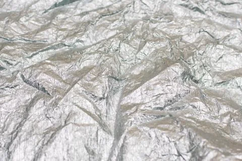 Silver gray background. Silver background with shiny uneven surface. Background Stock Photos