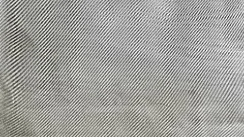 Silver gray woven fabric texture closeup showcases intricate diagonal threads Foto stock