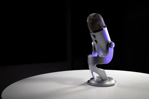 Silver grey USB condenser microphone with adjustable tabletop stand Stock Photos