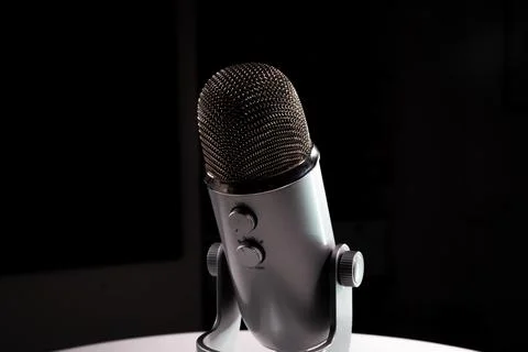 Silver grey USB condenser microphone with adjustable tabletop stand Stock Photos