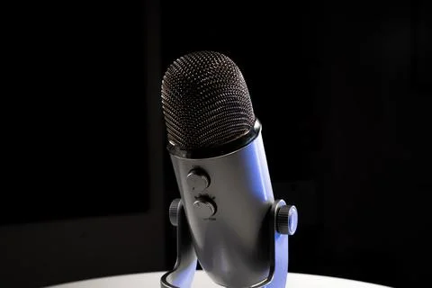 Silver grey USB condenser microphone with adjustable tabletop stand Stock Photos