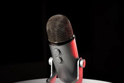 Silver grey USB condenser microphone with adjustable tabletop stand sitting o Stock Photos