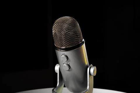 Silver grey USB condenser microphone with adjustable tabletop stand sitting o Stock-Fotos