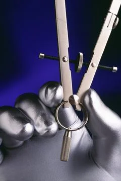 Silver Hand Holding Drafting Compass Foto stock