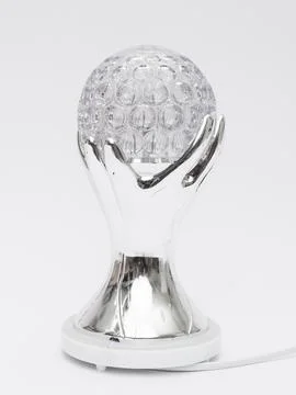 Silver hand shaped disco ball lamp side view Stock Photos