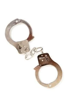 Silver handcuffs on a white background Stock Photos