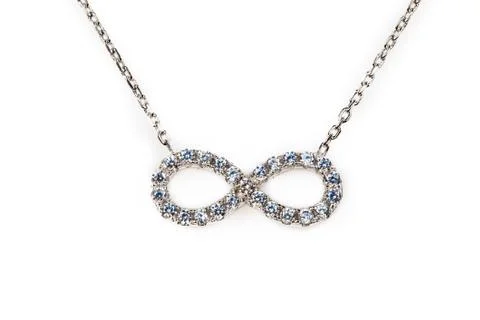 Silver infinity pendant with diamond Foto stock
