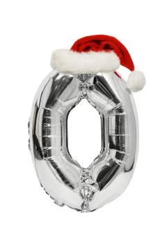 Silver inflatable balloon zero with a red Santa hat. White background. New Ye Stock Photos