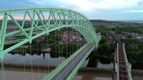 Silver Jubilee bridge aerial view forward towards Runcorn town coast 库存影片 342407807
