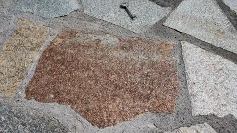 Silver Key Falling and Bouncing onto Stone Cobblestone Pavement Видео 347635333