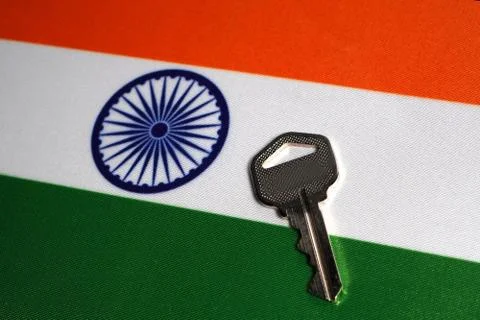 Silver key on the flag of India. Close-up, copy space Stock Photos