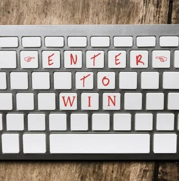 Silver keyboard with words: Enter to win Foto stock