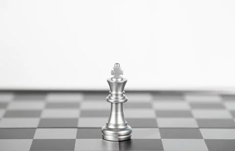 The silver king chess on the empty space board , business strategy Stock Photos